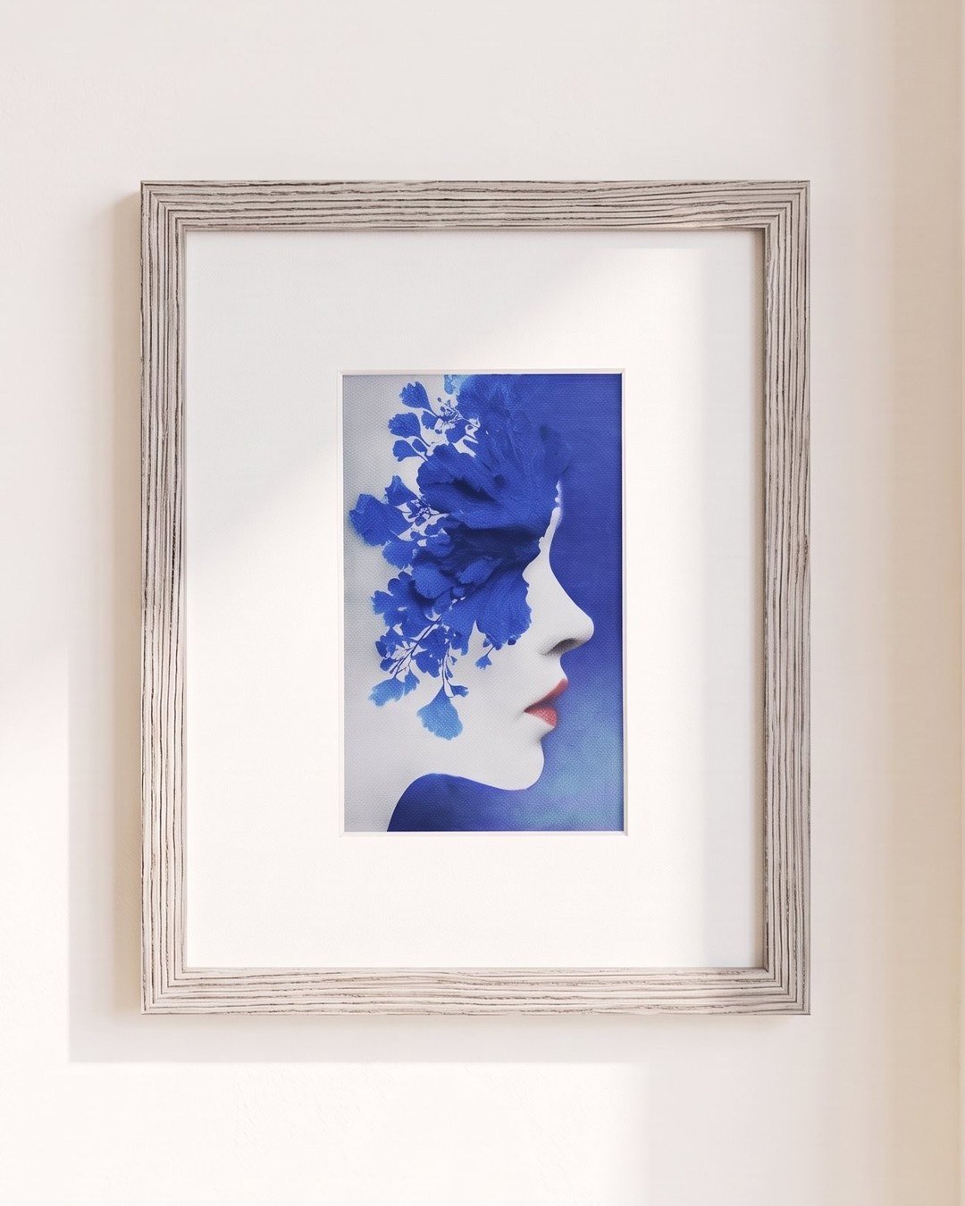 Four CanvasBT colour e-ink art frames arranged as a gallery wall above a plant shelf