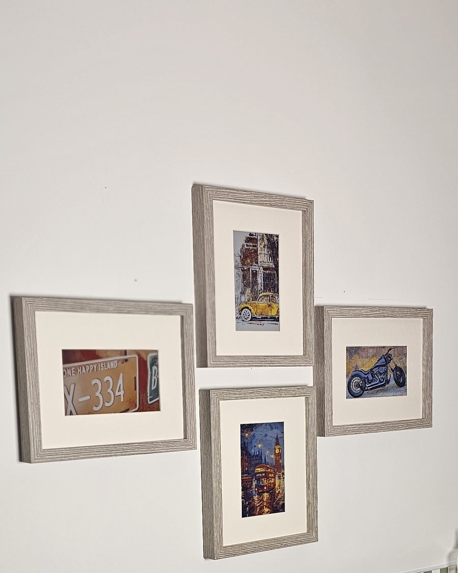Three CanvasBT frames on a living-room table, one propped on a stack of books